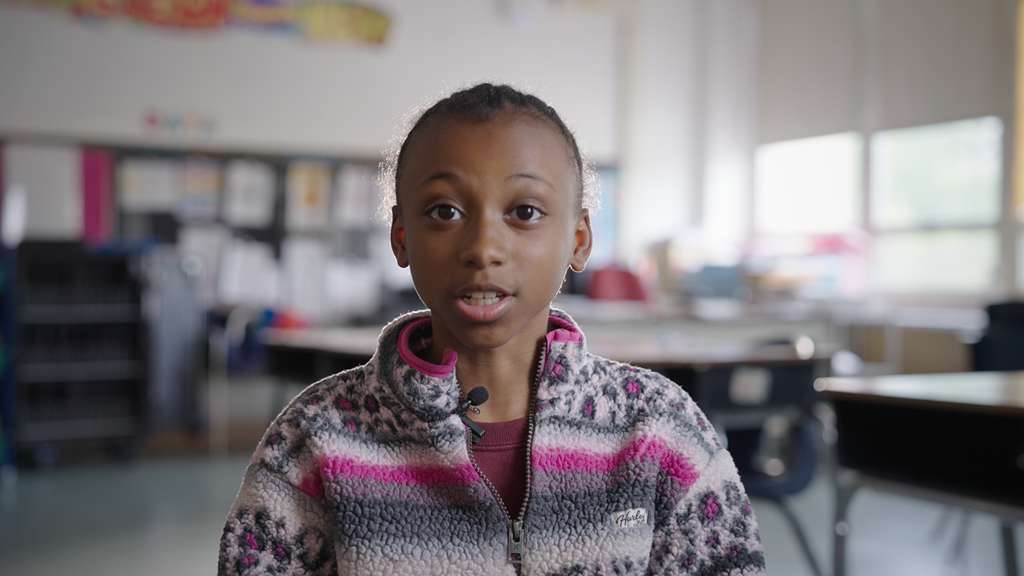 Mini Rebel sharing her story in the classroom