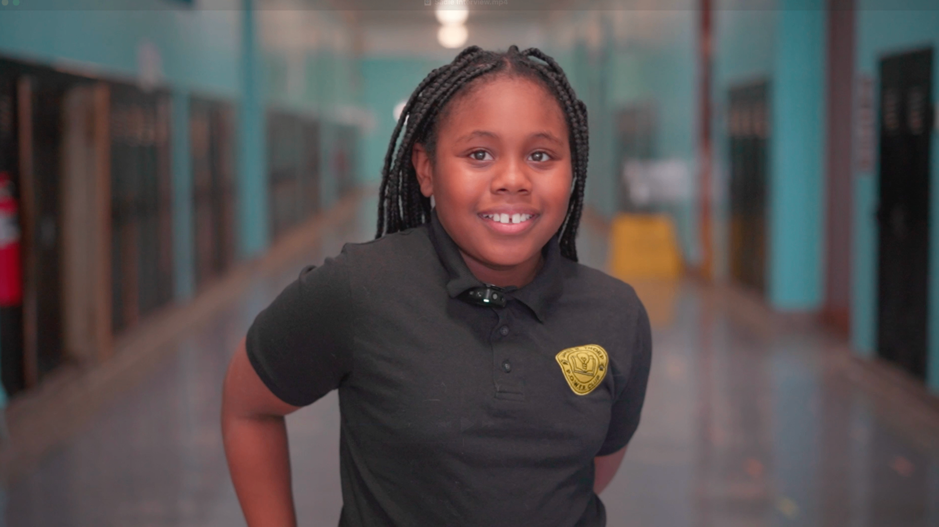 Student portrait in a school hallway